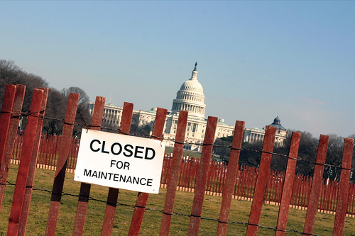 A sign that reads "Close for Maintenance" with the US Capitol in the background.