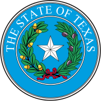 The seal of Texas, depicting a lone star encased by a wreath.