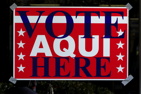 A bilingual sign directing voters to a polling place