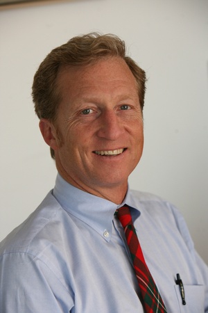 Tom Steyer in light blue shirt with red tie