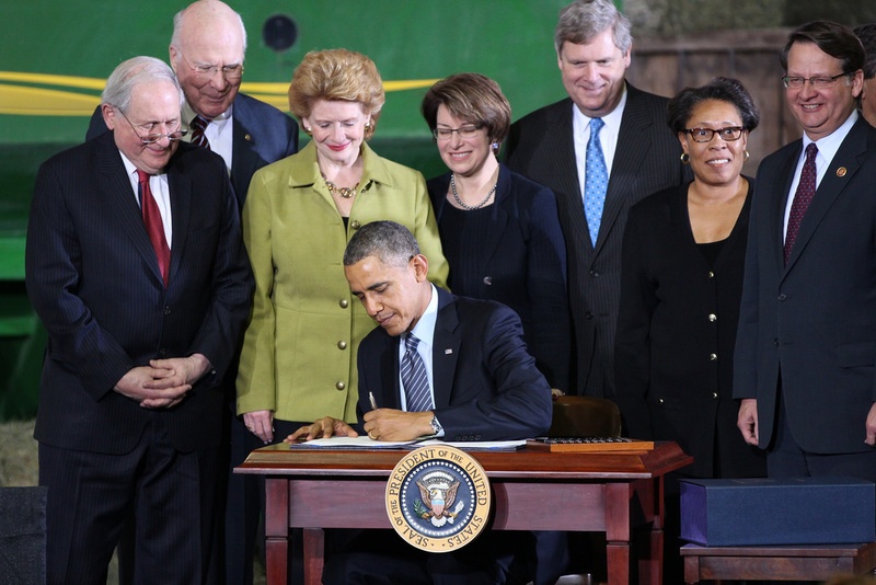 President Obama signing a bill into law
