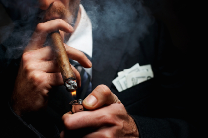 Close up of man smoking cigar