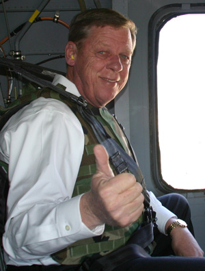 Senator Johnny Isakson gives the thumbs up while wearing ear plugs.