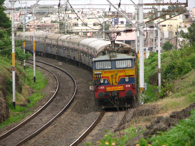 A train in India riding on tracks.