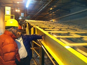 A photo deleted from the Twitter account of Sen. Angus King of him getting a tour of a highly automated lumber plant.