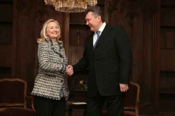 U.S. Secretary of State Hillary Rodham Clinton shakes hands with Ukrainian President Viktor Yanukovych.