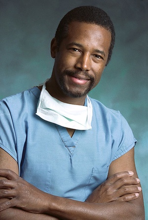 Photo of smiling African American man in surgical scrubs