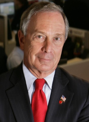 A picture of former New York mayor Michael Bloomberg with suit and red tie