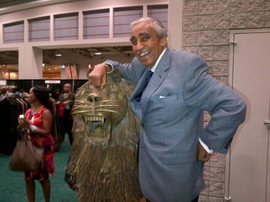 Rep. Charlie Rangel, D-N.Y., poses with a statue of a lion in a photo deleted from his campaign Twitter account.