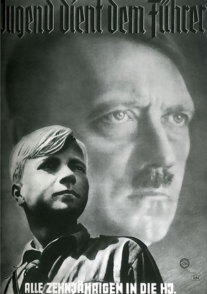 Image of young blonde boy looking up and right against backdrop of image of Hitler. German text above and below: Jugend dient dem Fuhrer; Alle zehnjahrigen in die HJ