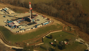 An image of shale gas drilling encroaching on rural residential life in southwestern Pennsylvania, 2012. 