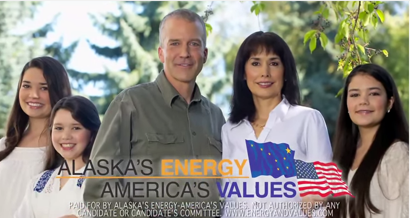 Republican candidate for U.S. Senate from Alaska Dan Sullivan, surrounded by his family. The words "Alaska's Energy America's Values" are on the screen along side Alaskan and American flags.