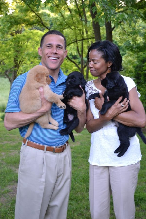 Gubernatorial candidate and Lt. Gov. Anthony Brown, D-Md., holds two puppies in a photo deleted from his campaign Twitter account and caught by Politwoops.