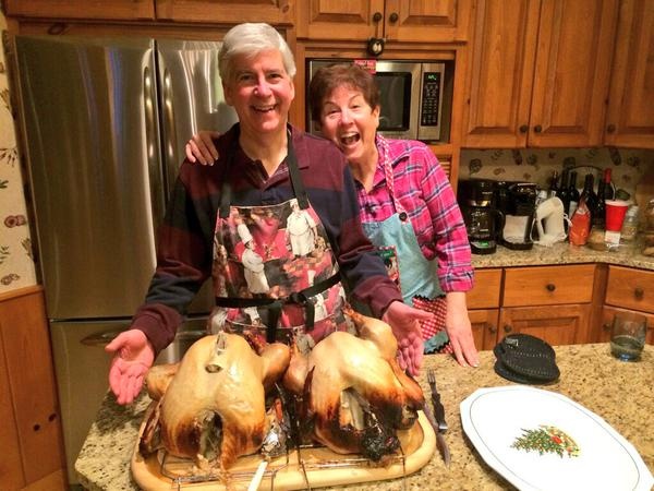 A deleted photo from the official account of Gov. Rick Snyder, R-Mich., showing him smiling with his wife and two turkeys.