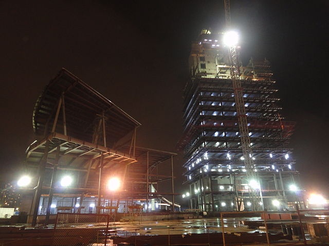 A tower under construction, photographed at night