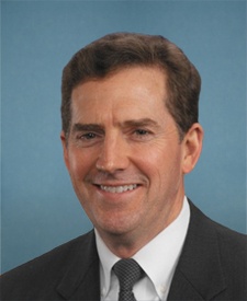 Head and shoulders shot of former Sen. Jim DeMint, white male with brown hair, in suitcoat