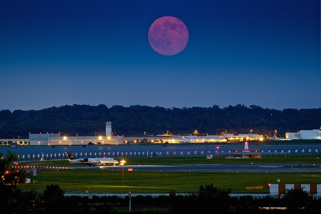 In this photo, a supermoon rises over DCA