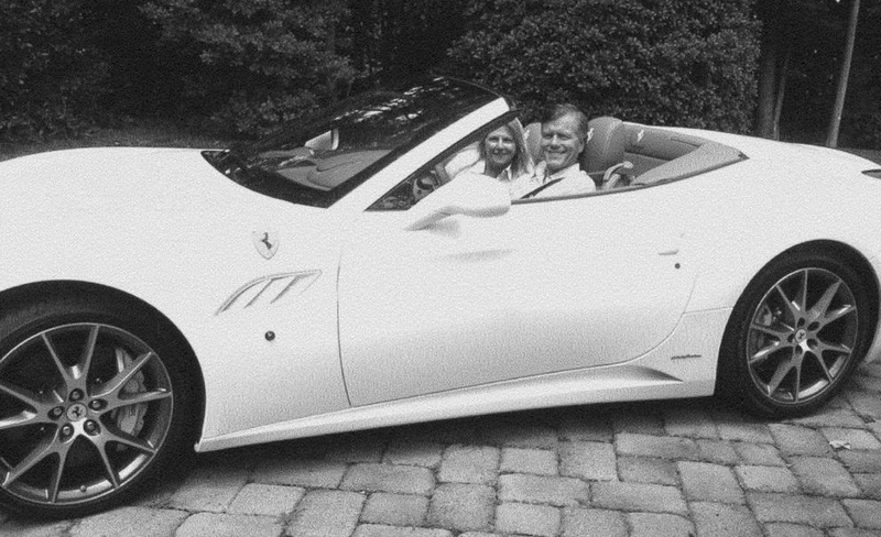 McDonnell and his wife, Maureen, posing in a white sports car.