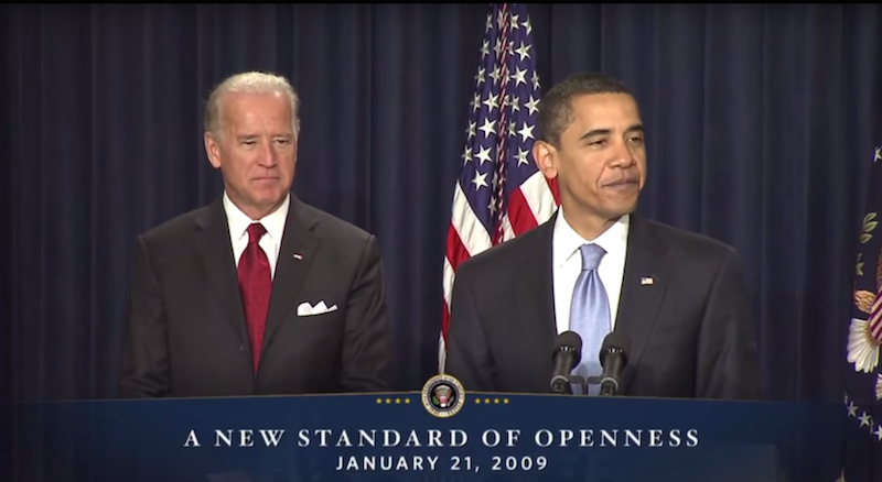 Joe Biden and Barack Obama standing at a podium.