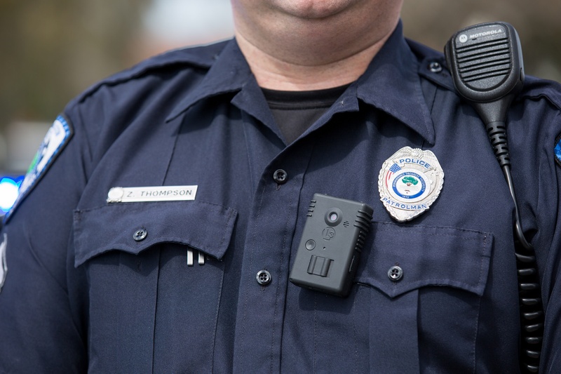 Close up of a police officer wearing a body camera.