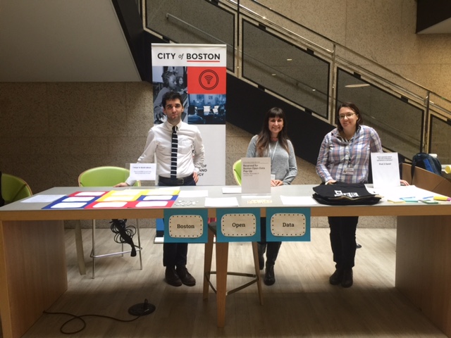 From left to right: Ben Green, Kayla Larkin and Renée Walsh setting up Boston Open Data’s pop-up table at the main branch of the Boston Public Library.